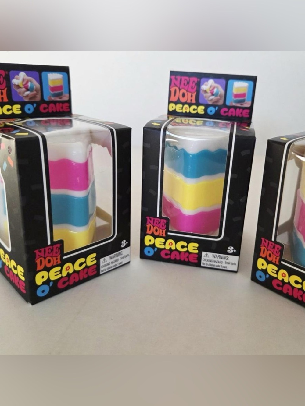 Original Nee Doh Peace O' Cake  - Pink, Blue, Yellow, White Cake Slice Squishy